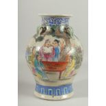 A CHINESE PORCELAIN VASE painted with flowers with four hands. 12ins high.