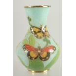 A SMALL CLOISONNE VASE with butterfly decoration, in original box.