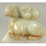 A CHINESE CARVED JADE RAM AND YOUNG. 2.25ins.