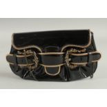 A SMALL FENDI BLACK AND GILT PATENT BAG the front with three buckles. 8ins long, 5ins high.