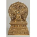 A GOOD GILT BRONZE BUDDHA AND SHRINE on a rectangular base. 11ins high.