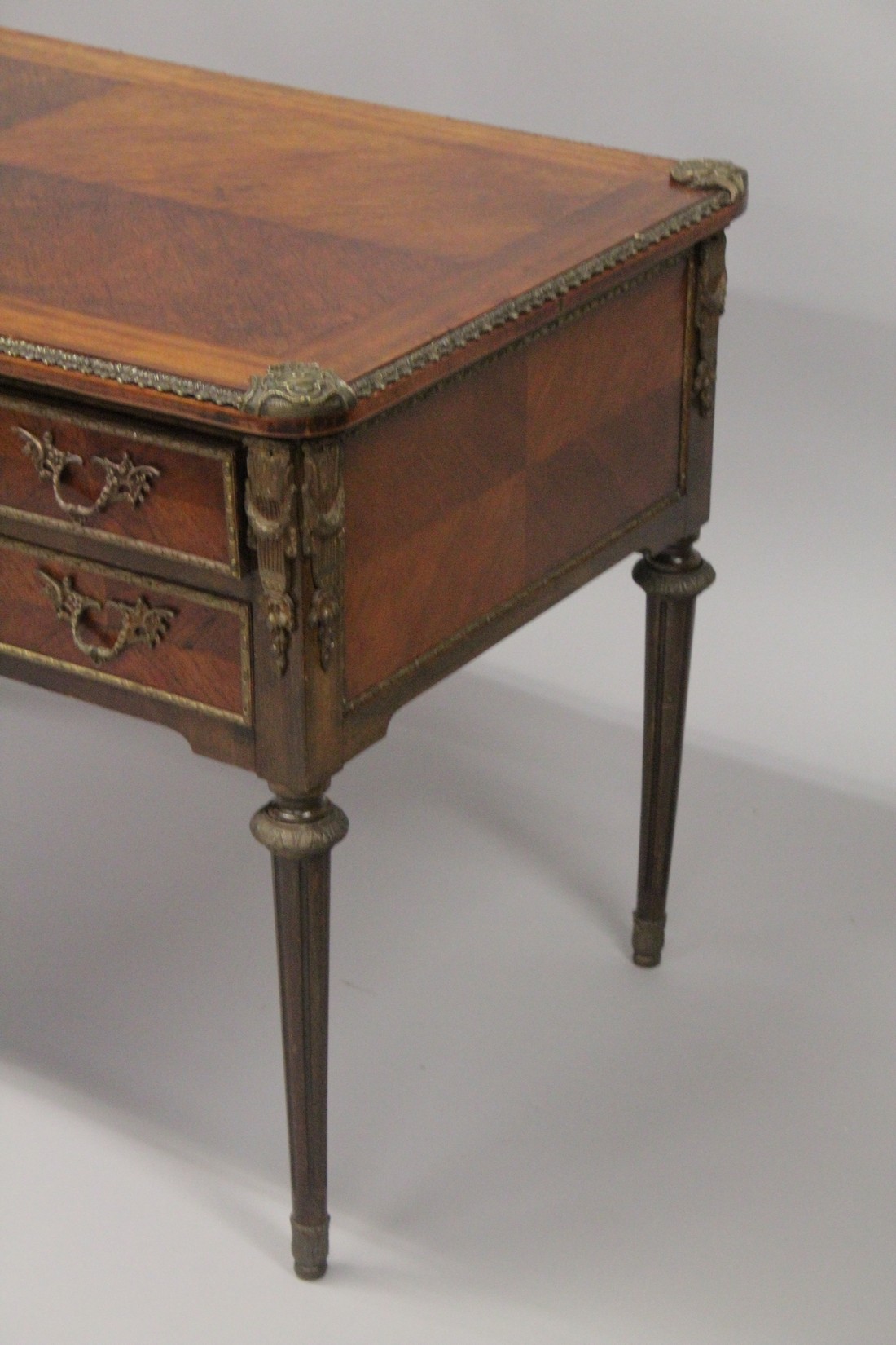 A LOUIS XVITH DESIGN WRITING TABLE with wooden top, five drawers on turned legs with ormolu - Image 7 of 7