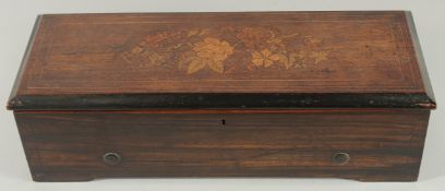 A GOOD SWISS MUSICAL BOX in an inlaid rosewood case, playing 8 airs. Drum 10.75ins long, case 1ft