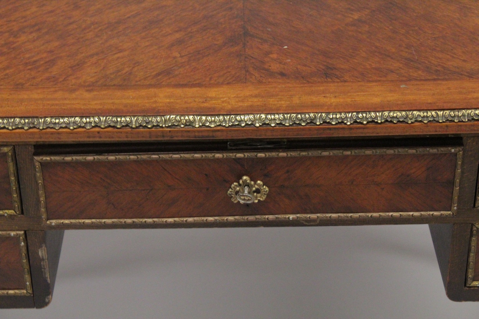 A LOUIS XVITH DESIGN WRITING TABLE with wooden top, five drawers on turned legs with ormolu - Image 3 of 7