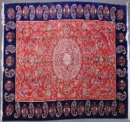 A VERY GOOD ISLAMIC CARPET, 20TH CENTURY, salmon pink with a rich blue border, having an allover