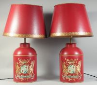 A PAIR OF RED TOLEWARE TINS as lamps with shades. Tins: 14ins high.