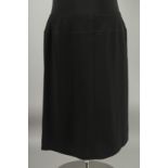 A CHANEL BLACK SKIRT, 100% wool with silk lining. Size 46 with Chanel hanger.