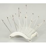 A CHRISTOPHER DRESSER DESIGN SILVER PLATED SIX DIVISION TOAST RACK.