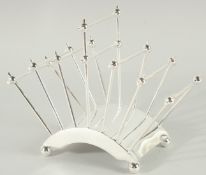 A CHRISTOPHER DRESSER DESIGN SILVER PLATED SIX DIVISION TOAST RACK.