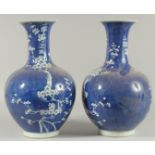 A PAIR OF CHINESE BLUE AND WHITE VASES, almond blossom. 14ins high.