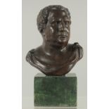 A BRONZE BUST on a marble base. 6ins high.