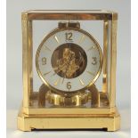 A LE COULTRE ATMOS CLOCK. No. 176787, with glass case. 9.5ins high.