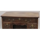 A GOOD GEORGE III MAHOGANY KNEEHOLE DESK with plain top, three small drawers either side of the
