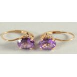 A PAIR OF GOLD AMETHYST EARRINGS.