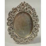 A GOOD RUSSIAN SILVER OVAL PHOTOGRAPH FRAME with scrolled mount. 7ins x 5ins. Mark, 84, Head.