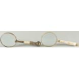 TWO MAGNIFYING GLASSES with mother of pearl handles.