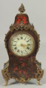 A 19TH CENTURY BOULLE CLOCK 12ins high.