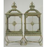 A LARGE PAIR OF COPPER RECTANGULAR LANTERNS on four curving legs. 28ins high.