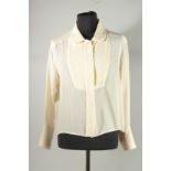 A CHANEL CREAM SILK BLOUSE, dress shirt front and double cuffs. Size label worn, approx. UK 14. Some