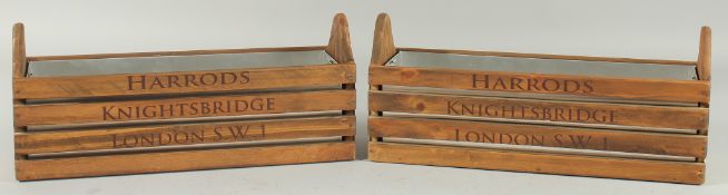 A PAIR OF HARRODS WOODEN BOXES with tin liners. 14ins long.