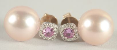 A PAIR OF 18 CT WHITE GOLD, PINK SAPPHIRE, DIAMOND AND 12mm PINK PEARL EAR STUDS.