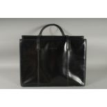 A LARGE GUCCI BLACK PATENT LEATHER BAG with large back pocket with toggle and zip, two straps,