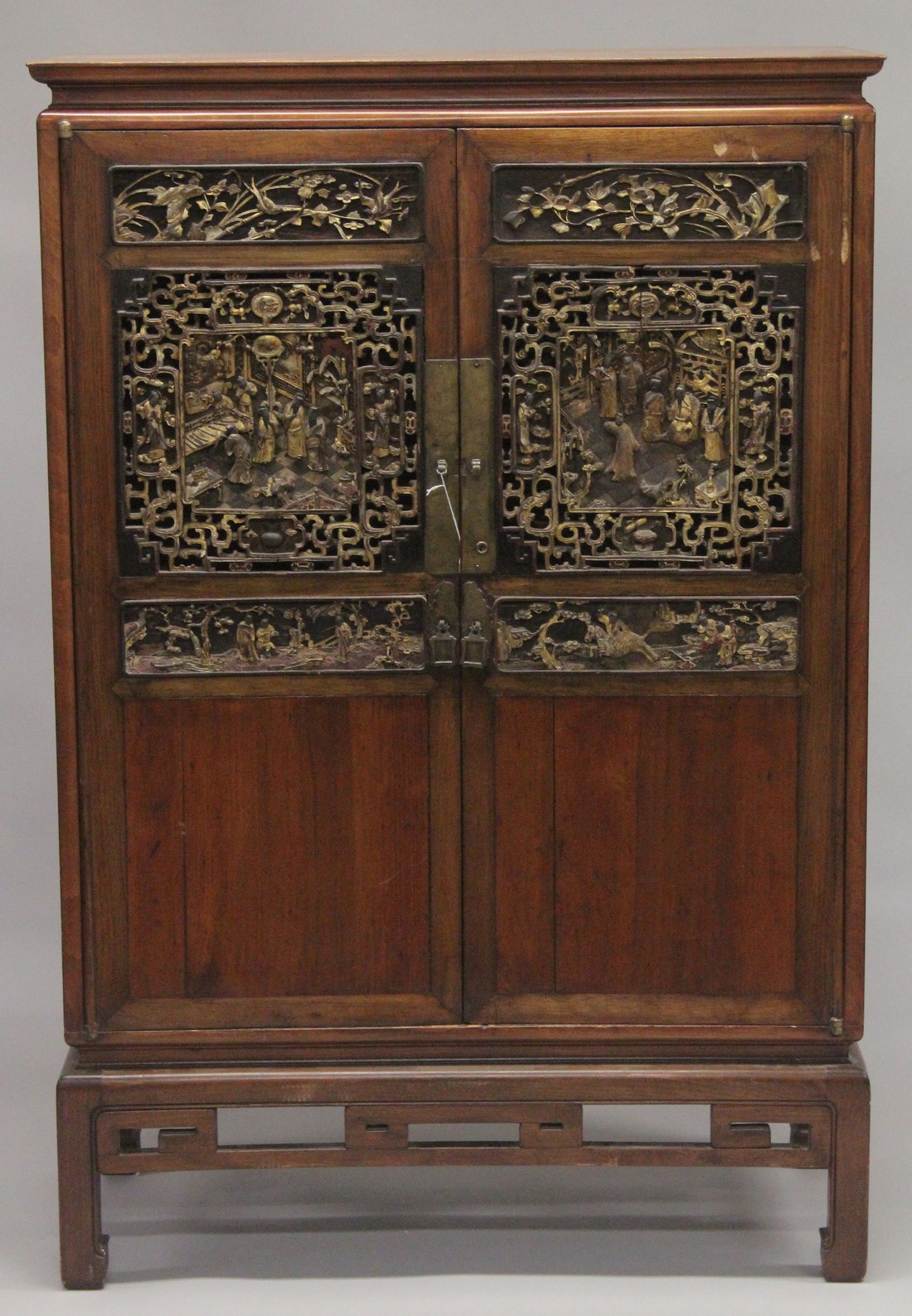 A 19TH CENTURY CHINESE CABINET with carved and pierced doors. 5ft high, 3ft 4ins wide.