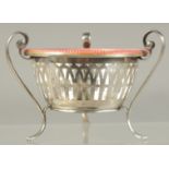 A GOOD RUSSIAN SILVER AND PINK ENAMEL BOWL inset with a medallion on three curving legs. 3.5ins