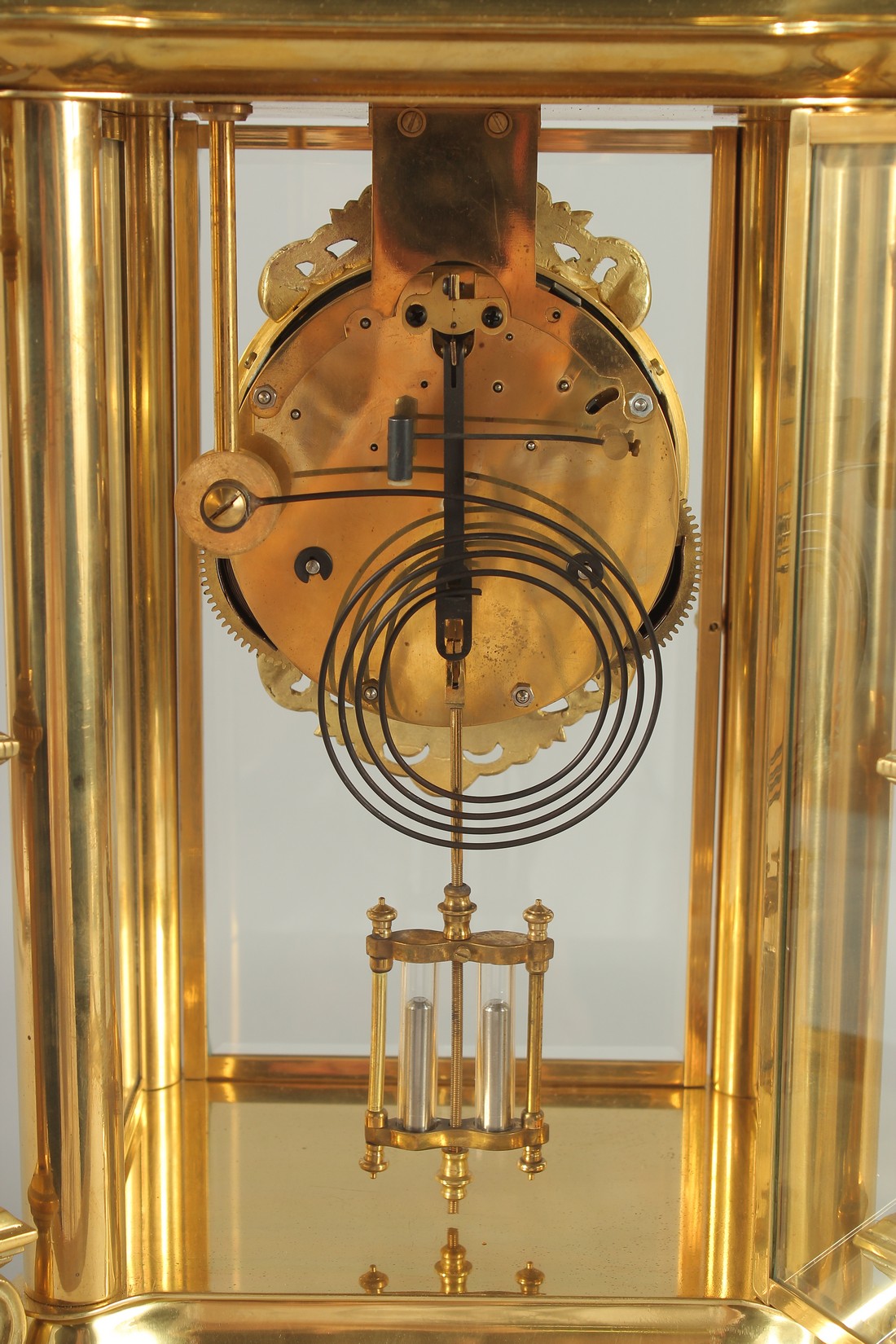 A GOOD GILT BRONZE FOUR GLASS CLOCK with pineapple finials on claw feet. 24ins high. - Image 5 of 5