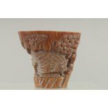 A SMALL CARVED HORN LIBATION CUP carved with birch and foliage. 4.5ins high, 4.75ins wide overall.