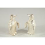 A PAIR OF SMALL SILVER PLATED PENGUIN SALT AND PEPPERS.