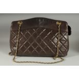 A GOOD CHANEL BROWN PADDED LEATHER BAG AND WALLET. Serial no. 1369616, with long gilt and leather