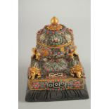 A TIBETAN FILIGREE DZI BEAD INSET PRAYER DECORATION,containing a scroll. 15.5cms long.