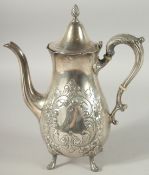 A STERLING SILVER COFFEE POT with repousse decoration on four pad feet. 26ozs.