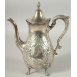 A STERLING SILVER COFFEE POT with repousse decoration on four pad feet. 26ozs.