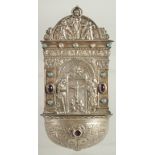 A RARE EARLY CONTINENTAL SILVER FONT. 7.5ins long set with carbouchon stones and religious symbols.