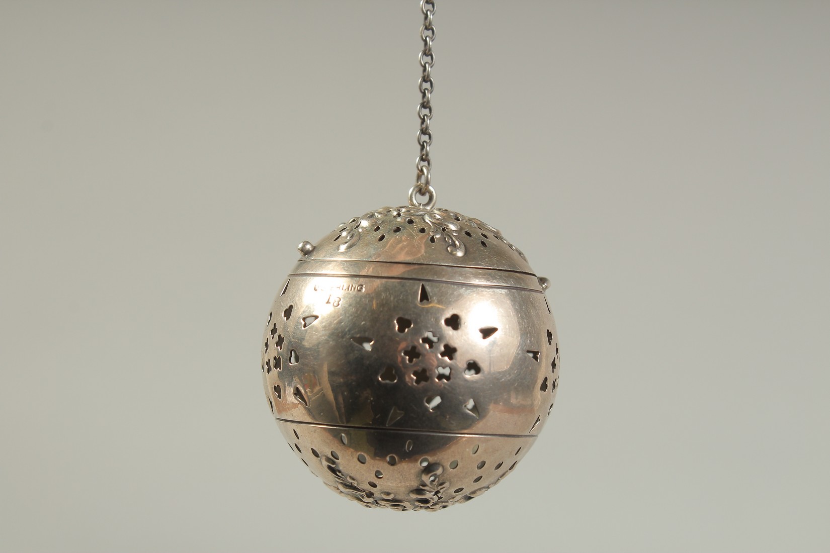 A SILVER GLOBULAR TEA INFUSER on a chain. 1.75ins diameter. - Image 3 of 4