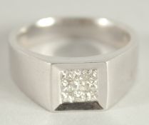 A HEAVY 18CT WHITE GOLD, HALLLMARKED TABLET RING. Diamonds approx. 0.5 carat.