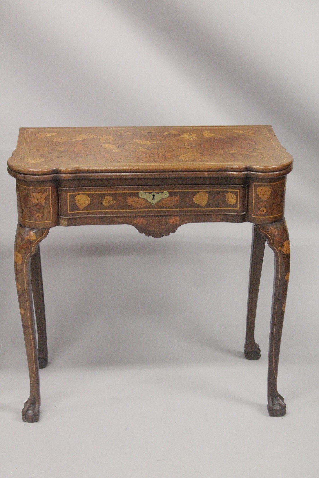 A NEAR PAIR OF 18TH CENTURY DUTCH MARQUETRY FOLDING TOP CARD TABLES inlaid with flowers, birds and - Image 3 of 11