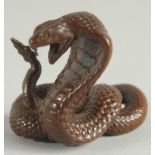 A JAPANESE BRONZE OKIMONA of a snake.