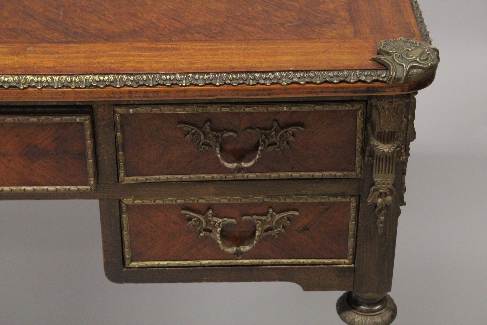 A LOUIS XVITH DESIGN WRITING TABLE with wooden top, five drawers on turned legs with ormolu - Image 4 of 7