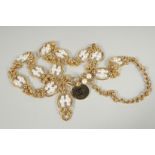 A VERY GOOD CHANEL GILT AND PEARL NECKLACE with twelve sections with six pearls. 36ins long.