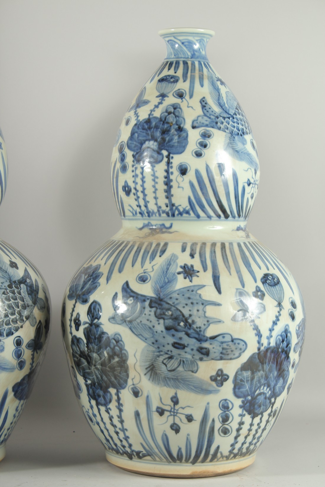 A GOOD PAIR OF CHINESE BLUE AND WHITE PORCELAIN GOURD VASES. 24ins high. - Image 3 of 3