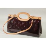 A GOOD LOUIS VUITTON BROWN/ MAROON PATENT LEATHER MONOGRAM HAND BAG. 12.5ins long