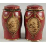 A SMALL PAIR OF TOLEWARE TEA CANISTERS AND COVERS. 6.5ins high.
