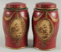 A SMALL PAIR OF TOLEWARE TEA CANISTERS AND COVERS. 6.5ins high.