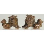 A SMALL PAIR OF BRONZE FOO DOGS. 2ins.