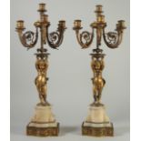 A GOOD PAIR OF 19TH CENTURY ORMOLU AND ONYX FIVE BRANCH, SIX LIGHT CANDELABRAS, the ornate scrolling