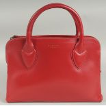 A RADLEY, LONDON, RED LEATHER BAG, with two short handles and long strap. 34cm long, 20cm high, 10cm