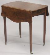 A GEORGE III MAHOGANY BUTTERFLY PEMBROOKE TABLE with shaped folding flap, end drawer on tapering